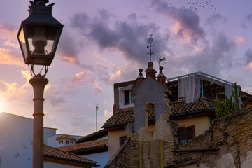Cordoba streets at sunset in historic city center near Mezquita Cathedral.
