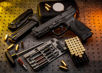Black modern pistol on a dark back. A short-barreled weapon for concealed carry. Armament of the...