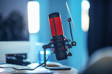 professional red microphone in the foreground, entertainment and communication concept