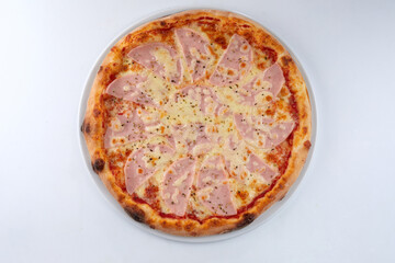 fresh pizza on the white plate