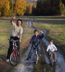 Naklejka premium Family On Cycle Ride In Countryside enjoying a bike trip