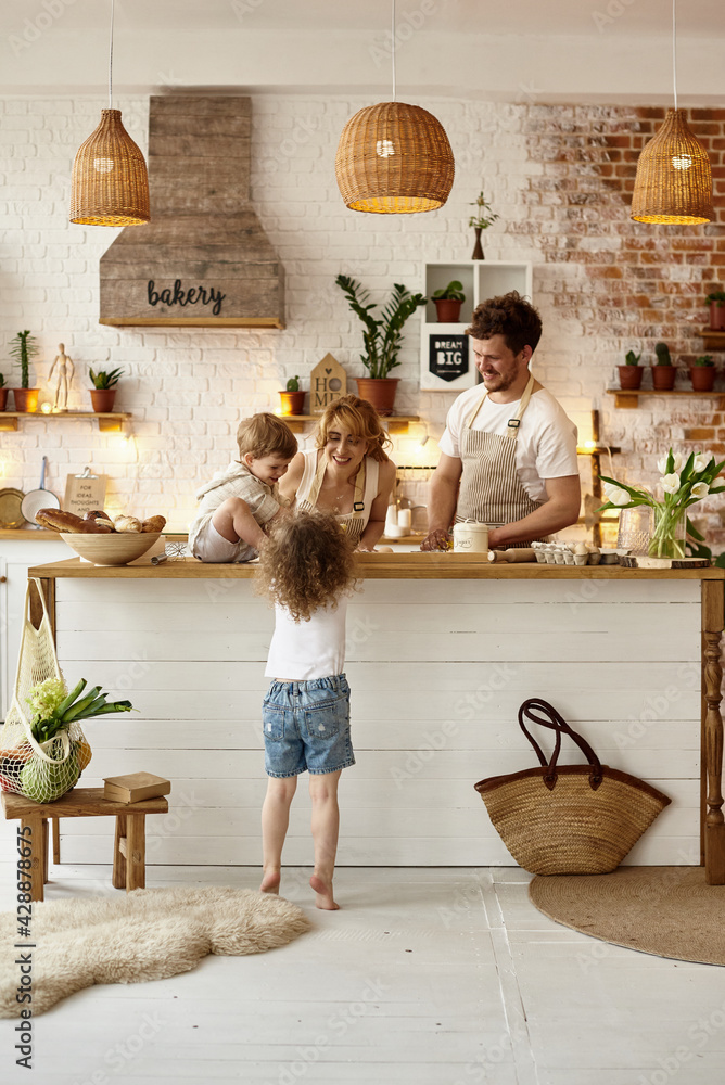 Wall mural happy family cooking in the kitchen