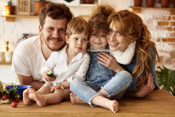 happy family having fun in the kitchen