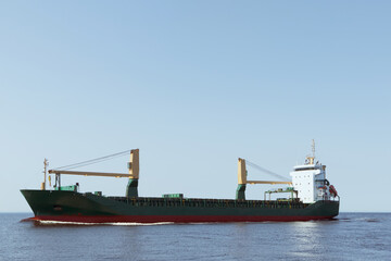 Fototapeta premium A large cargo ship is sailing at sea. Soft focus