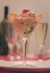 Fresh cocktail prawns is on center stage of a spread table. Cocktail prawns is the meal's starter