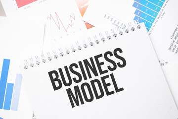 business model text on paper on the chart background with pen