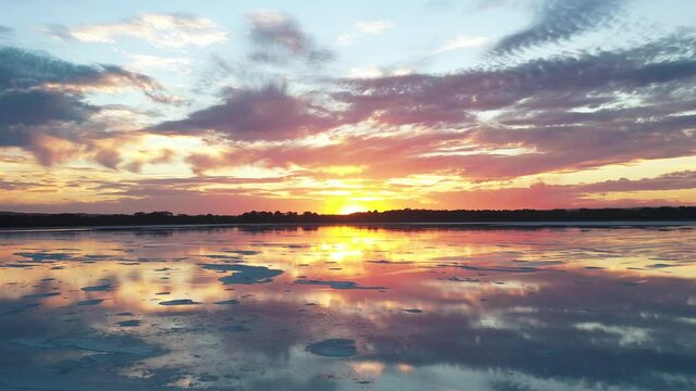 2020 - The sun sets on Pink Lake in Esperance, Australia.