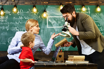 Family education and people concept. Good teachers help little students pupil.