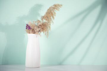 pampas grass and flower in vase