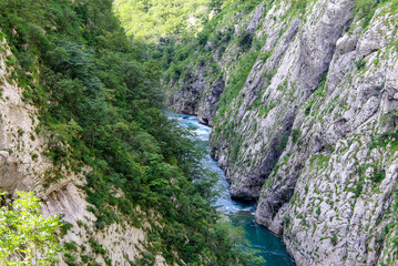 Montenegro mountains landscape . The blue river flows in a deep canyon among high mountains covered with green forest in Montenegro. Nature background