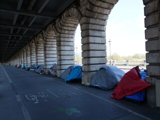 Some tents of homeless people under the Parisian Bercy bridge. Paris, France