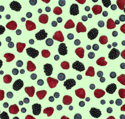 Berries pattern isolated on light green. Strawberries, raspberries blackberries and blueberries arranged on light green.