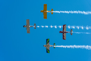 airplanes flyby at air show with smoke trails