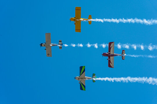 airplanes flyby at air show with smoke trails