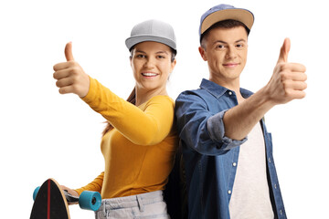 Young people with a longboard showing thumbs up
