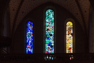 Zurich, Switzerland - April 19. 2021 : stained glass window of the Protestant church Fraumunster designed by Marc Chagall - obrazy, fototapety, plakaty