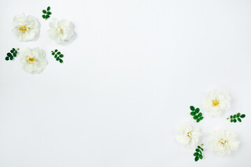 Floral composition. White flowers roses on white background. Spring, summer concept. Flat lay, top view, copy space.