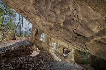 Beautiful Limestone cave, Old Oolitic stone quarries in Massone, The extracted stone, called "statuary stone"Arco, Italy. Bosco Caproni