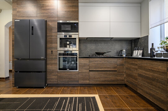 Modern luxury large dark brown, gray and black kitchen details
