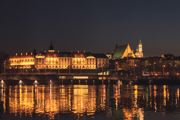 Obraz na płótnie Canvas Night view of Warsaw, Poland. Attractions of the European capital. Old town Krakowskie Przedmiecie.