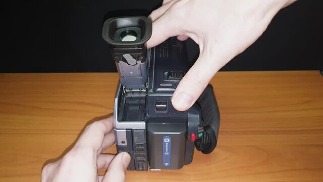 Unfolding and turning on the dv tape camcoder