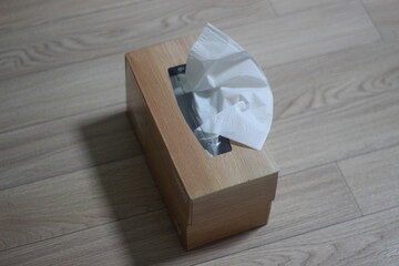 Tissue box on wooden table