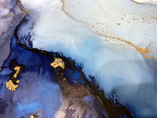 Abstract blue art with gold — fluid background with beautiful smudges and stains made with...