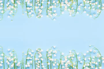 Zelfklevend Fotobehang Lily of the valleys flowers on a light blue background. Mothers Day, Valentines Day, bachelorette © Laima