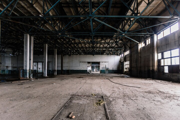 Old abandoned large industrial hall. Empty warehouse