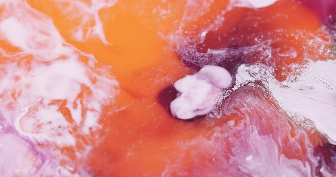 Macro Textures with Vibrant Neon Color Palette. Abstract Background Made with Oil Mixed with Orange and Red Dye, Ink, and Paint.