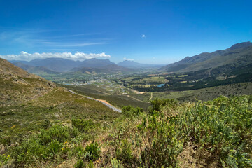 Scenic view Franschhoek valley panorama with its famous wineries and surrounding mountains, South Africa.