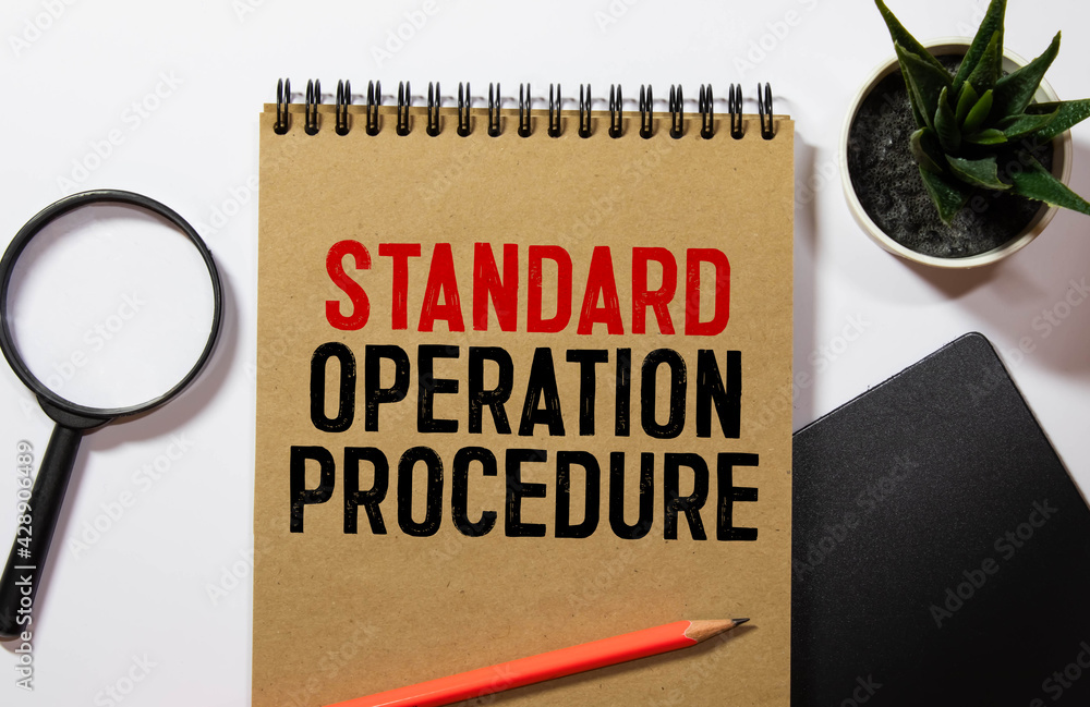 Poster standard operating procedure text on torn paper in open diary with spectacles
