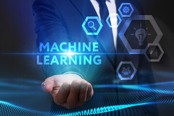 Business, Technology, Internet and network concept. Young businessman working on a virtual screen of the future and sees the inscription: Machine learning