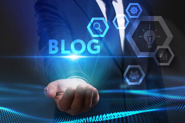 Business, Technology, Internet and network concept. Young businessman working on a virtual screen of the future and sees the inscription: Blog