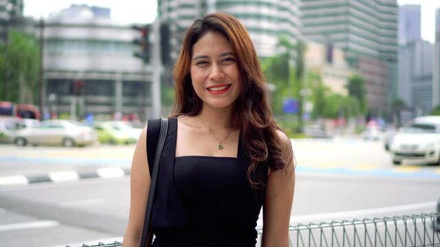 Travel Concept, Asian Tourist at Kuala Lumpur smile to the camera