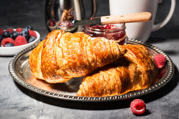 croissant with raspberry jam and raspberries