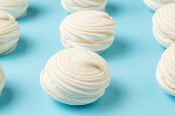 Freshly prepared meringue on a light blue background.