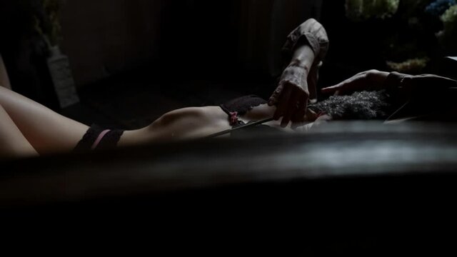 excited half-naked woman is lying on sofa and wiggling in extasy