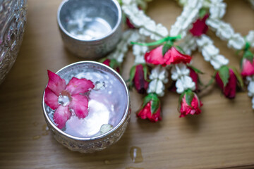 Close-up background Of Buddha images and flowers for ceremonies on auspicious days (New Year, Songkran Festival)