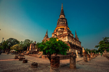 Fototapeta premium Background of old Buddha statues in Thai religious attractions in Ayutthaya Province, allowing tourists to study their history and take public photos.