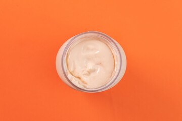 Mayonnaise can on the orange background