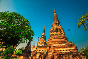 Fototapeta premium Background of old Buddha statues in Thai religious attractions in Ayutthaya Province, allowing tourists to study their history and take public photos.