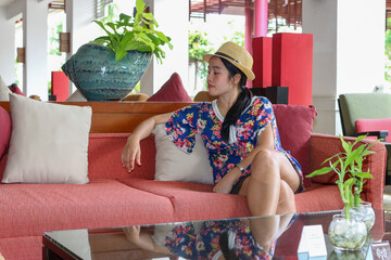 Asian young woman in the hotel lobby during holiday tourism