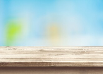 Wooden empty table top on blur background