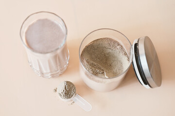 whey drink in a high glass. whey protein chocolate cocktail. morning drink for health and beauty. top view. sport nutrition supplement.