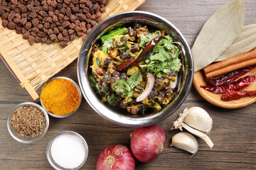 Bengali style black chickpeas chana sola lentil dal peas bhuna recipe onion garlic dry chili bay leaf cinnamon fumaric power cumin seeds salt