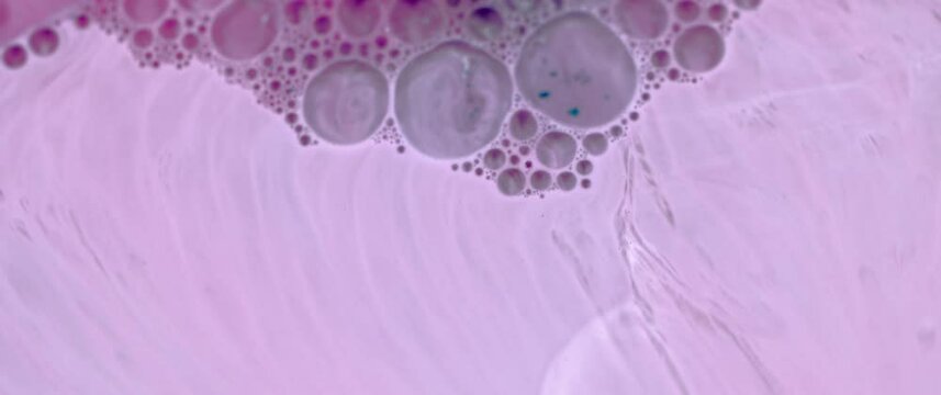 Macro Textures with Vibrant Neon Color Palette. Abstract Background Made with Oil Mixed with Purple Dye, Ink, and Paint.