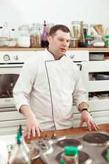 the chef shows a master class in the kitchen, shows the students a cooking lesson
