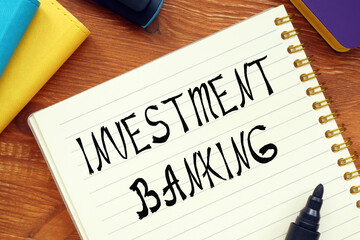 Financial concept meaning INVESTMENT BANKING question marks with phrase on the page.