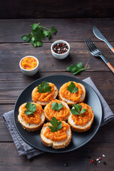 Sandwiches with bread zucchini caviar tomatoes onions. Homemade vegetarian food. Canned stewed vegetable. wooden background copy space